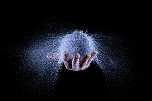 hand and balloon water explosion