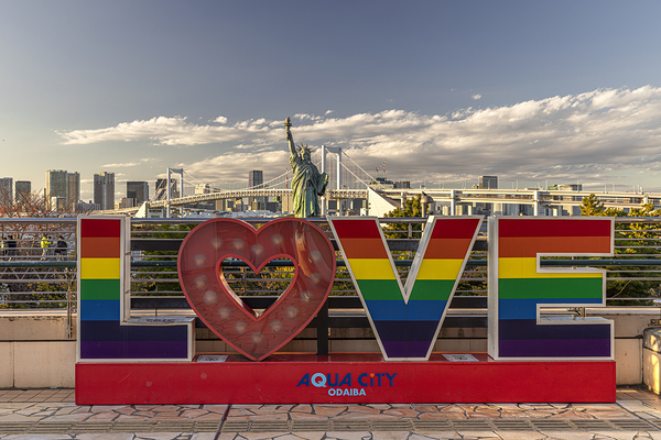 Rainbow love sign standing in front of rainbow bridge  tokyo Print