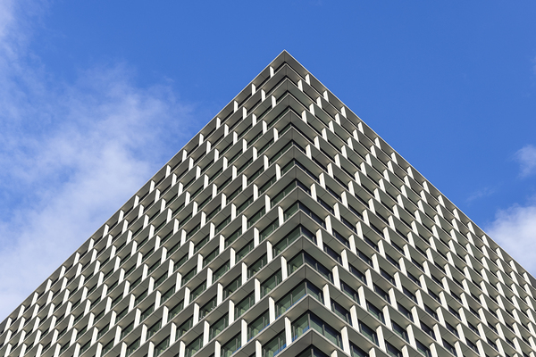 Modern building facade reaching for the blue sky by Gualtiero Boffi