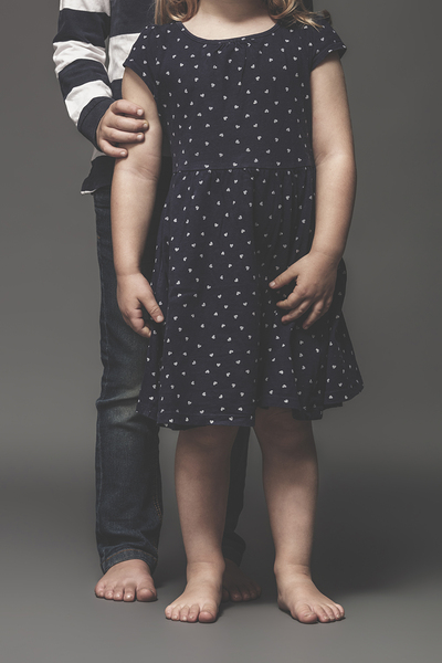 portrait of sibling children barefoot