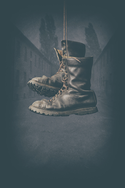 hanging leather military boots  by Gualtiero Boffi