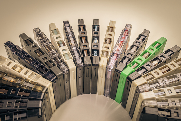 old cassettes arranged in an arc background Print