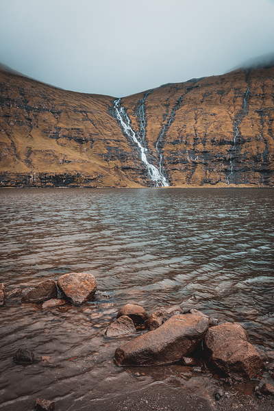 waterfalls that flow into the lake of Saksun in the Faroe