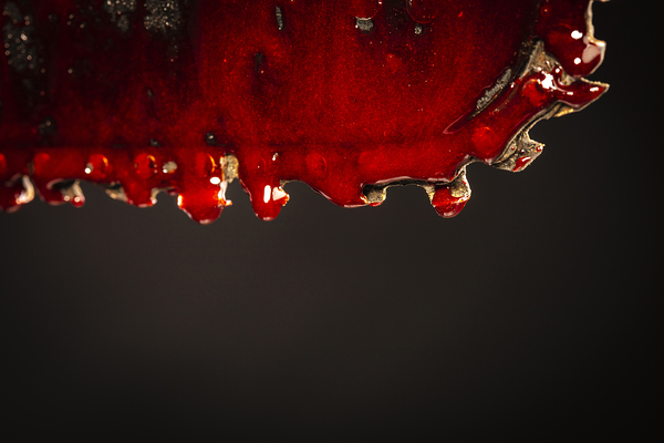 detail of a chainsaw blade full of blood