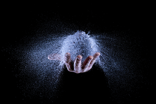 hand and balloon water explosion