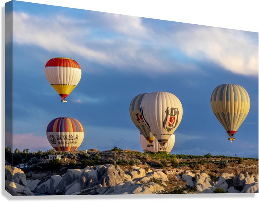 Hot air balloons fly over Goreme. Turkey Canvas Print