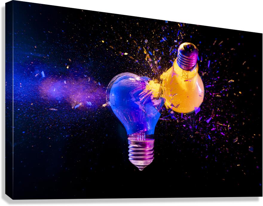 Two colorful light bulbs exploding in a cloud of shards Canvas Print
