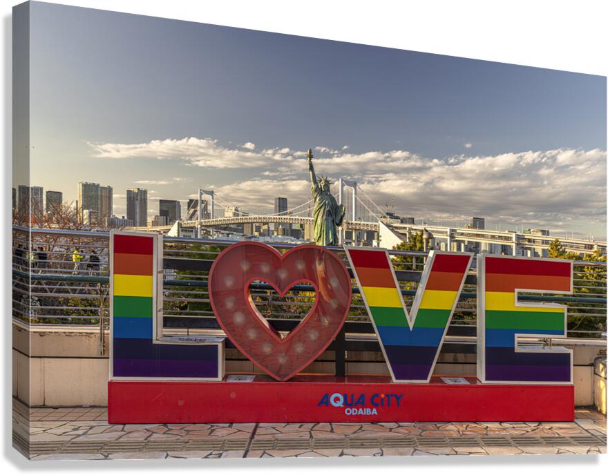 Rainbow love sign standing in front of rainbow bridge  tokyo Canvas Print