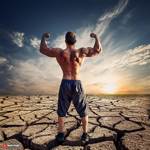A strong steadfast person with his back to the camera on cracked dry ground. His body is solid and his muscles are prominent and his stance is strong confident and defiant in the face of nature. It appears in the painting which gives a sense of determinat