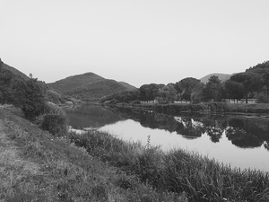 Black and white River meets mountain
