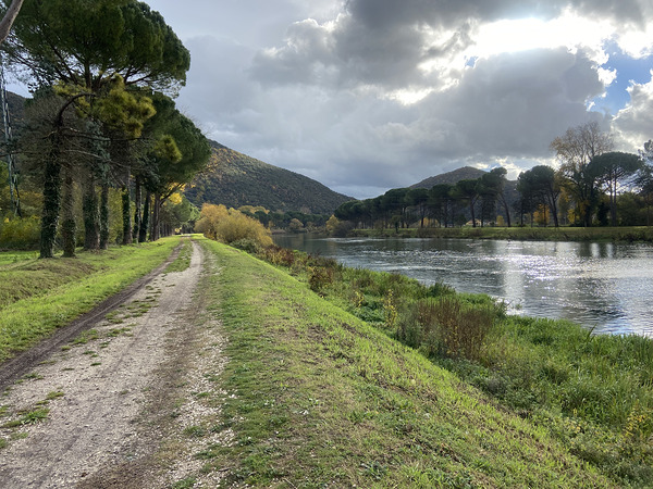 Strolling by a river Print