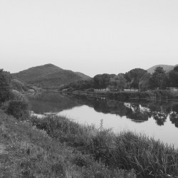 Black and white River meets mountain