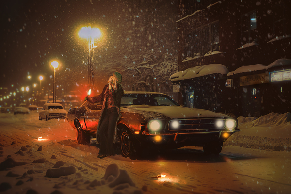 Vintage winter scene of a 70s young woman leaning against her broken down car on a snowy city street in a snowstorm lighting up a cigarette with a distress flare by Artmood Visualz