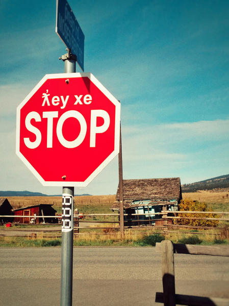 Bilingual stop sign in English and First Nations language. by Kevin Miller Photography