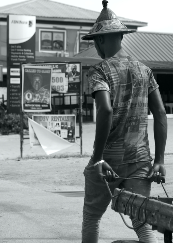 Endurance in Motion: A Young Ghanaians Hustle on the Streets by Ganyobiphotos
