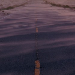 Endless Journey: Windswept Road Through the Imperial Sand Dunes Yuma AZ