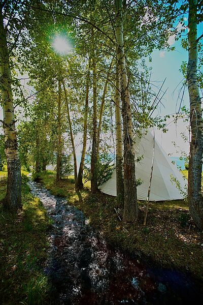 Donovo: Visible Sun Native American Teepee Scene by Michael W Rutherford