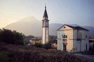 Church in northern italian village during sunset