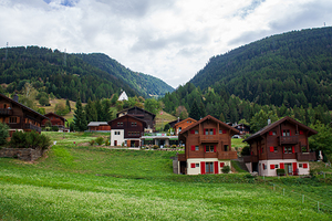 Charming houses dotting the Swiss Alps in Switzerland.