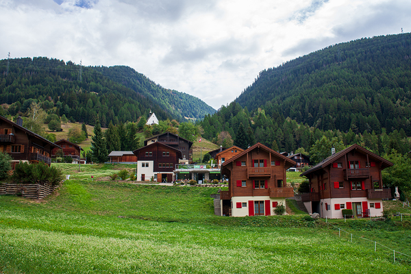 Charming houses dotting the Swiss Alps in Switzerland. Print