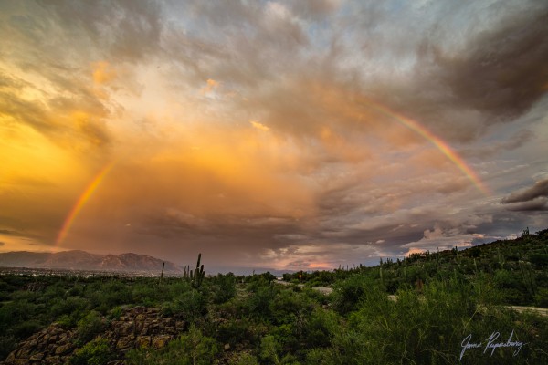 Rainbow over Picture rocks by James Rupersburg