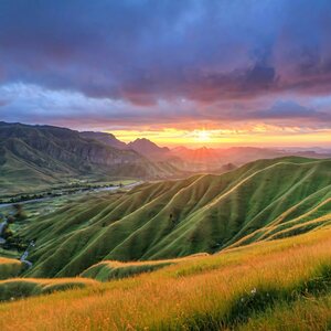 landscape photo mountain range sunrise green fiel