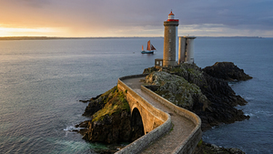 Sailboat passing Phare du Petit Minou