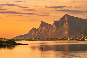Evening view of Lofoten Norway orange sunset over mountains