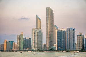 Abu Dhabi skyline at sunset from the Abu Dhabi view point in the UAE hazy sky
