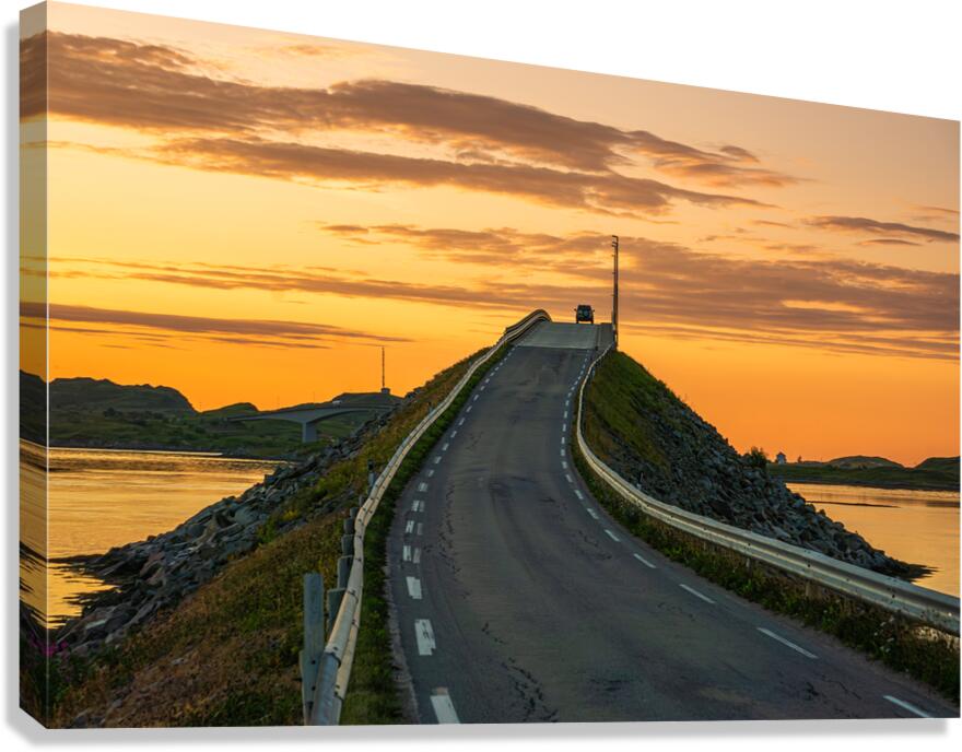 A car on the Fredvang bridges in Lofoten Norway with a beautiful sunset over the sea.  Canvas Print