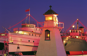 Christmas lights on ships and lighhouse