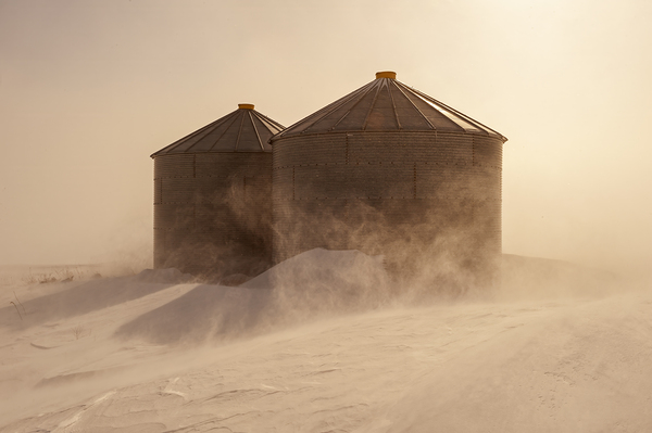 Grain Storage Bins in the Blizzard by Dave Reede Photohgraphy