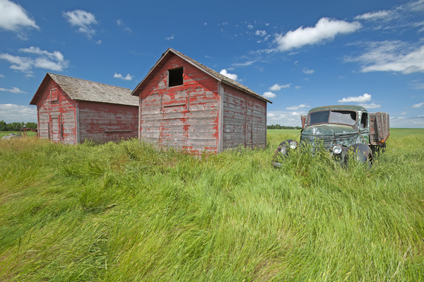 old farm truck beside grain bin by Dave Reede Photohgraphy