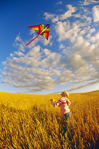 girl flying a kite by Dave Reede Photohgraphy