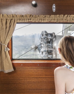 Girl Looking Out An Airplane Window