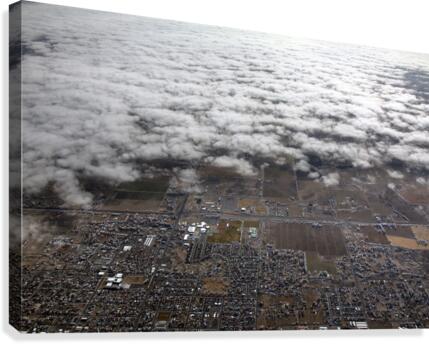 Clouds Obscuring a Town Canvas Print