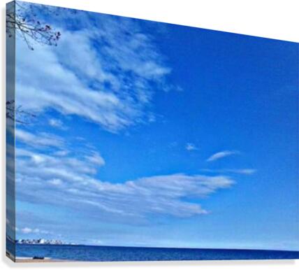 Blue Sky over the beach Canvas Print