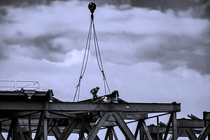 Welder on a bridge