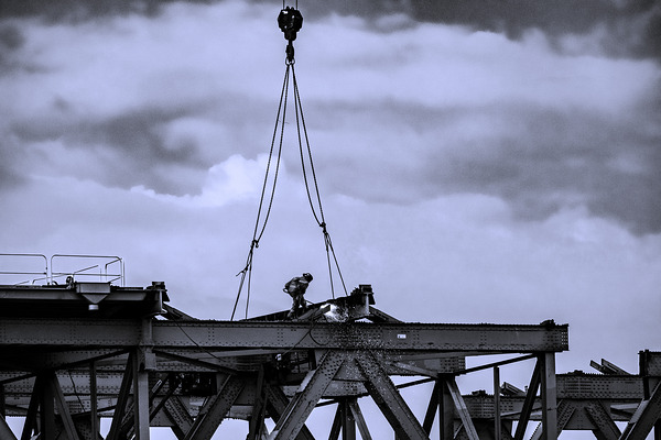 Welder on a bridge by NavPa