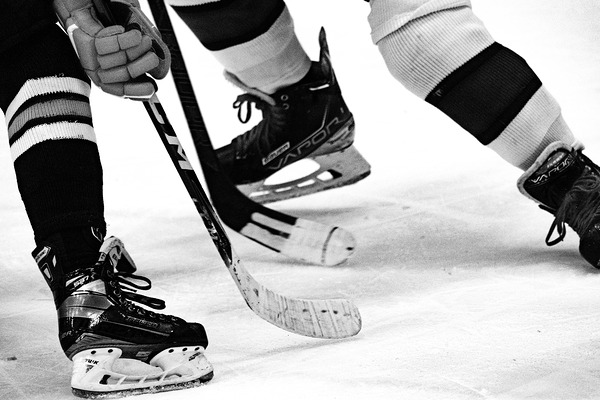  Hockey skaters at faceoff  by NavPa