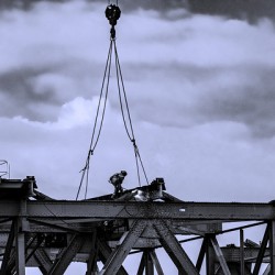 Welder on a bridge