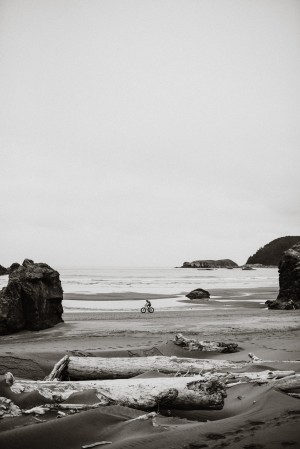 Cyclist on the beach B&W