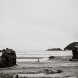 Cyclist on the beach B&W