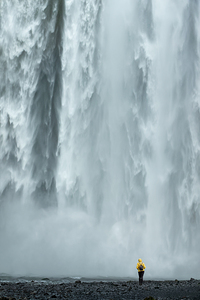 Woman at Skogafoss waterfall Iceland