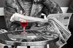 Red wine and newspaper in Paris