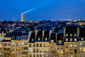 View of the roofs of Paris at night