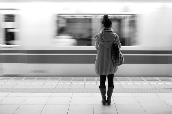 Woman waiting for the train in Tokyo Print