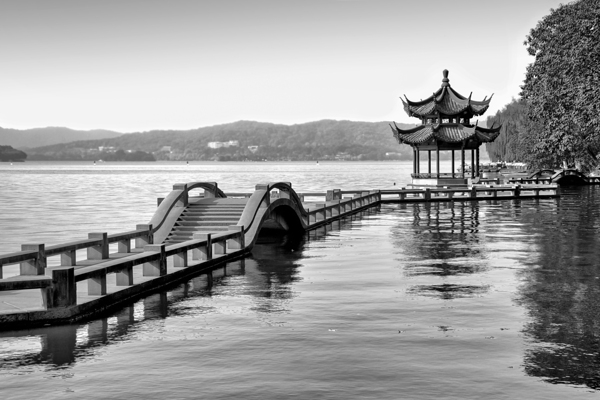 Chinese bridge and pavilion on Hangzhou lake China
