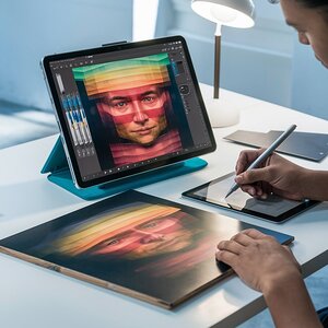 Artist working on a lawyered digital on a tablet 