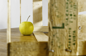 Green apple and wooden crate